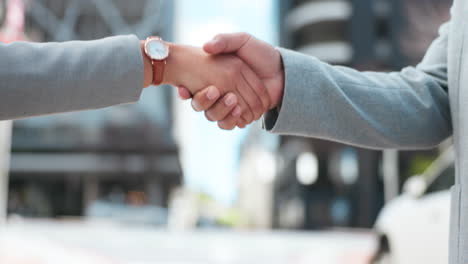 business people, meeting and shaking hands in city