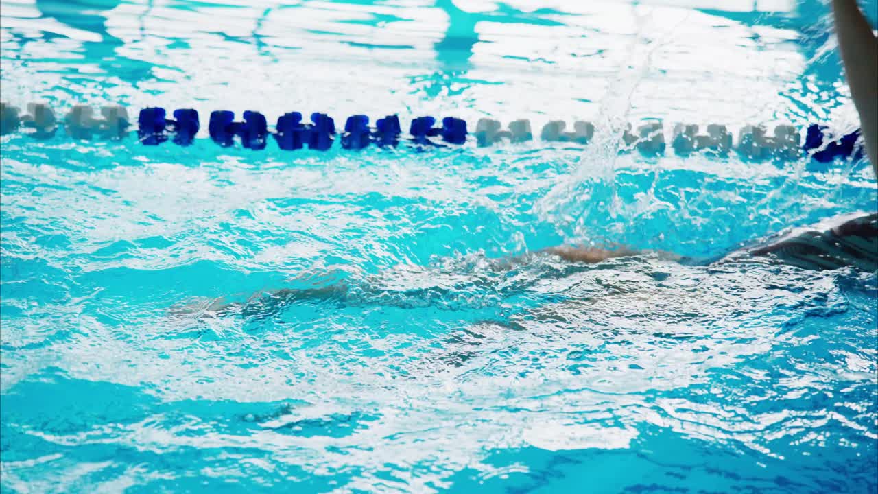 Calm and Rippling Waters: A Close-Up Exploration of Reflections and Patterns in a Tranquil Swimming Pool Environment