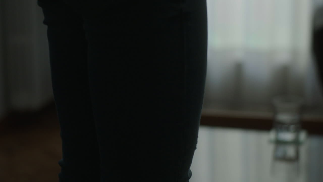 Woman holding a phone in a room