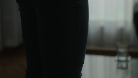 woman holding a phone in a room