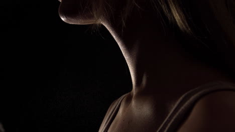 woman's neck while using perfume
