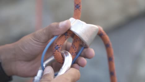 climber preparing for climbing up the mountain by checking rope