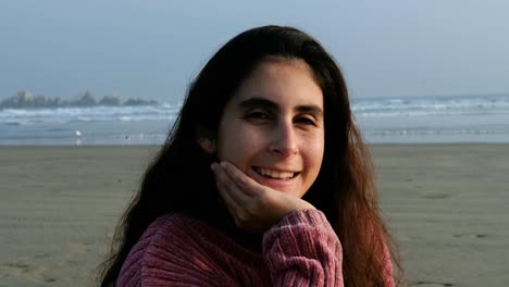 portrait of a girl at the beach looking at the camera