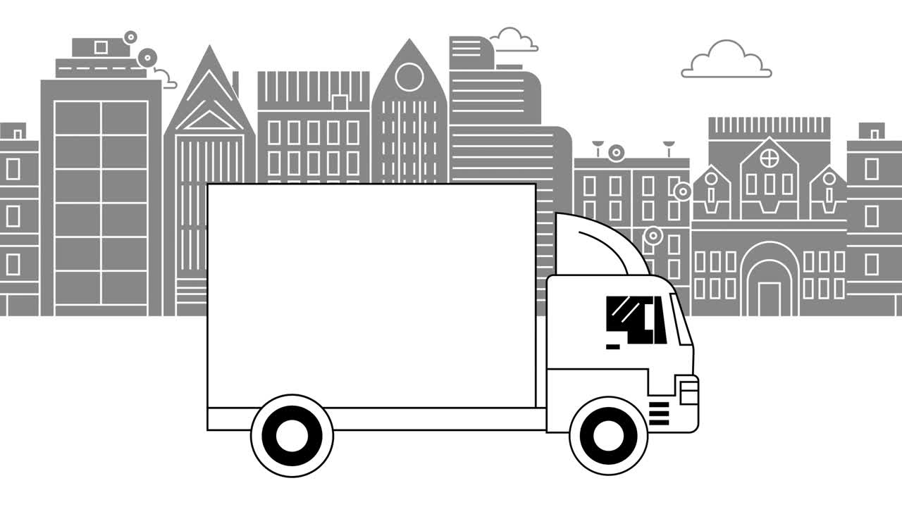 흑백 트럭이 큰 바디로 도시를 가로질러 달린다.