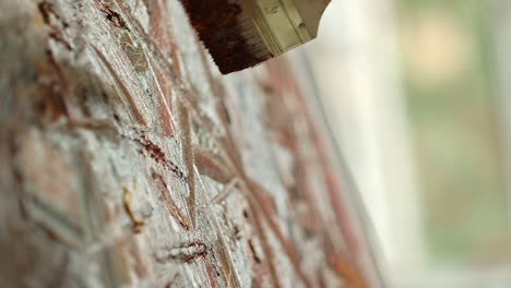 unknown woman creating masterpiece indoor. painter hand holding brush in studio.