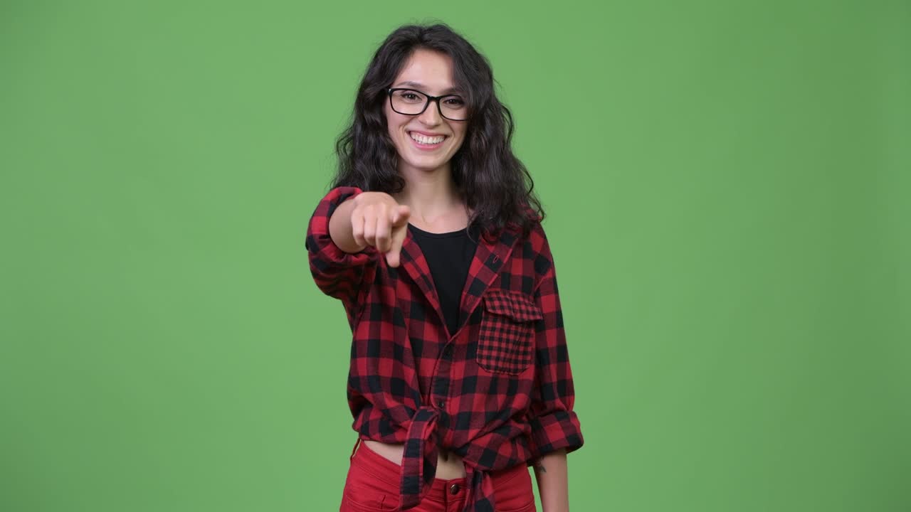 Young beautiful businesswoman pointing at camera