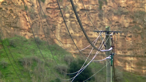 Some electricity wires dangling in the wind.