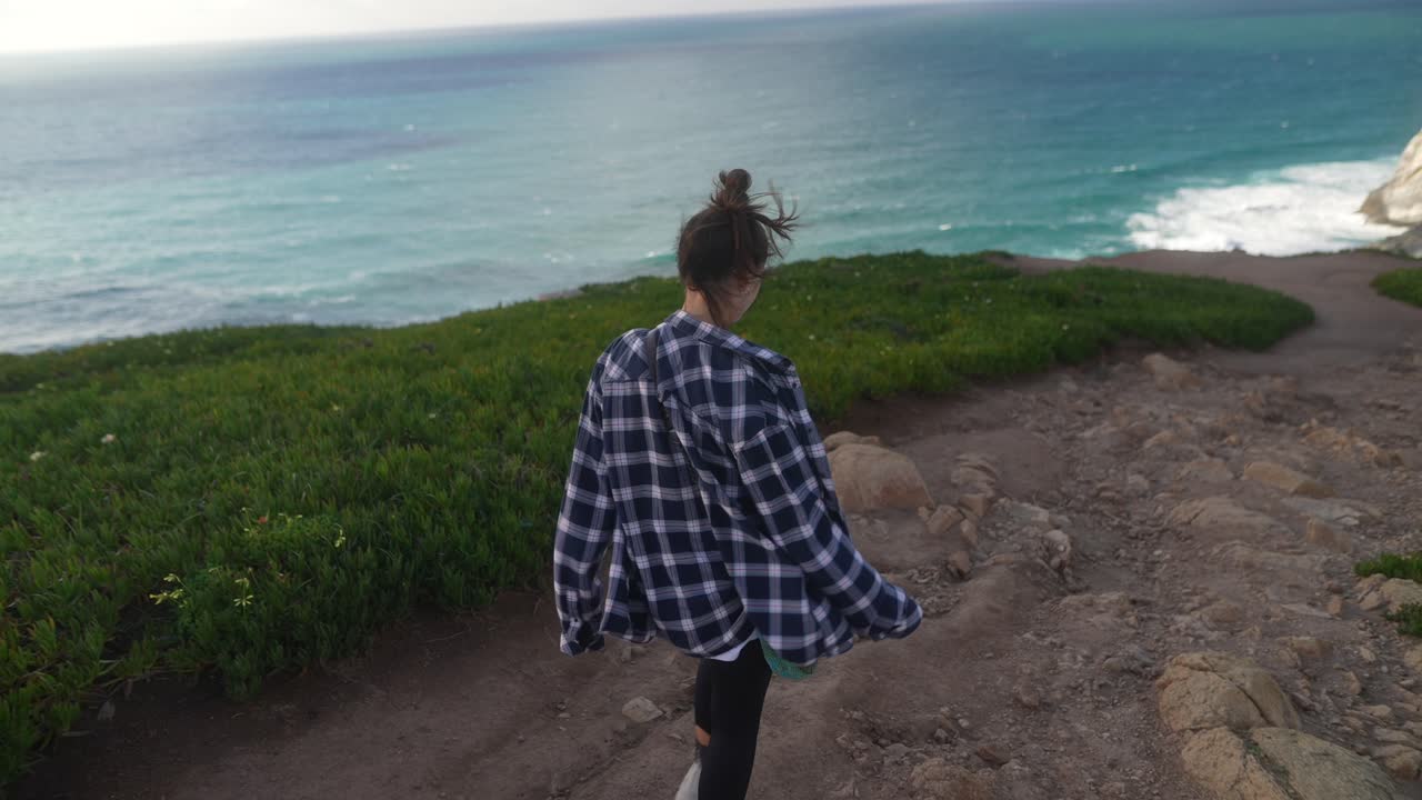 Woman Hiking on Coastal Trail