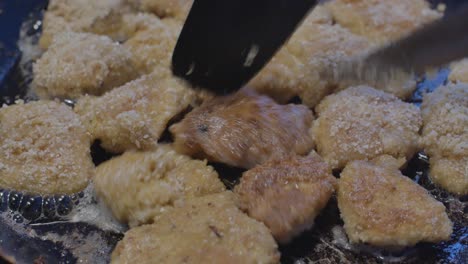 Chicken-Fillet-Pieces-Rolled-in-Breadcrumbs-are-Flipped-in-a-Hot-Pan-and-Baked-at-Home