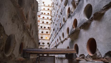 slow tilt up of a big crumbling abandoned dovecote from the xviii century in the south of spain.