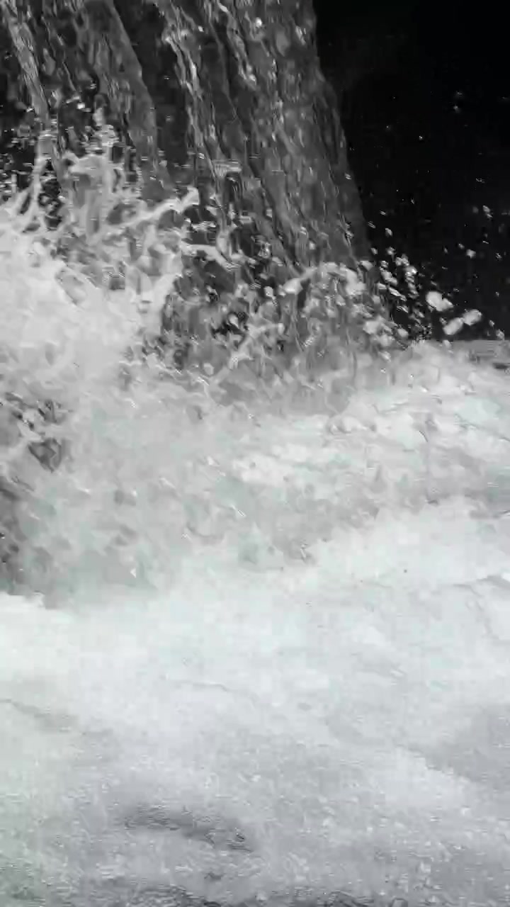 Close-up of Rushing Waterfall Water Cascading into a Pool