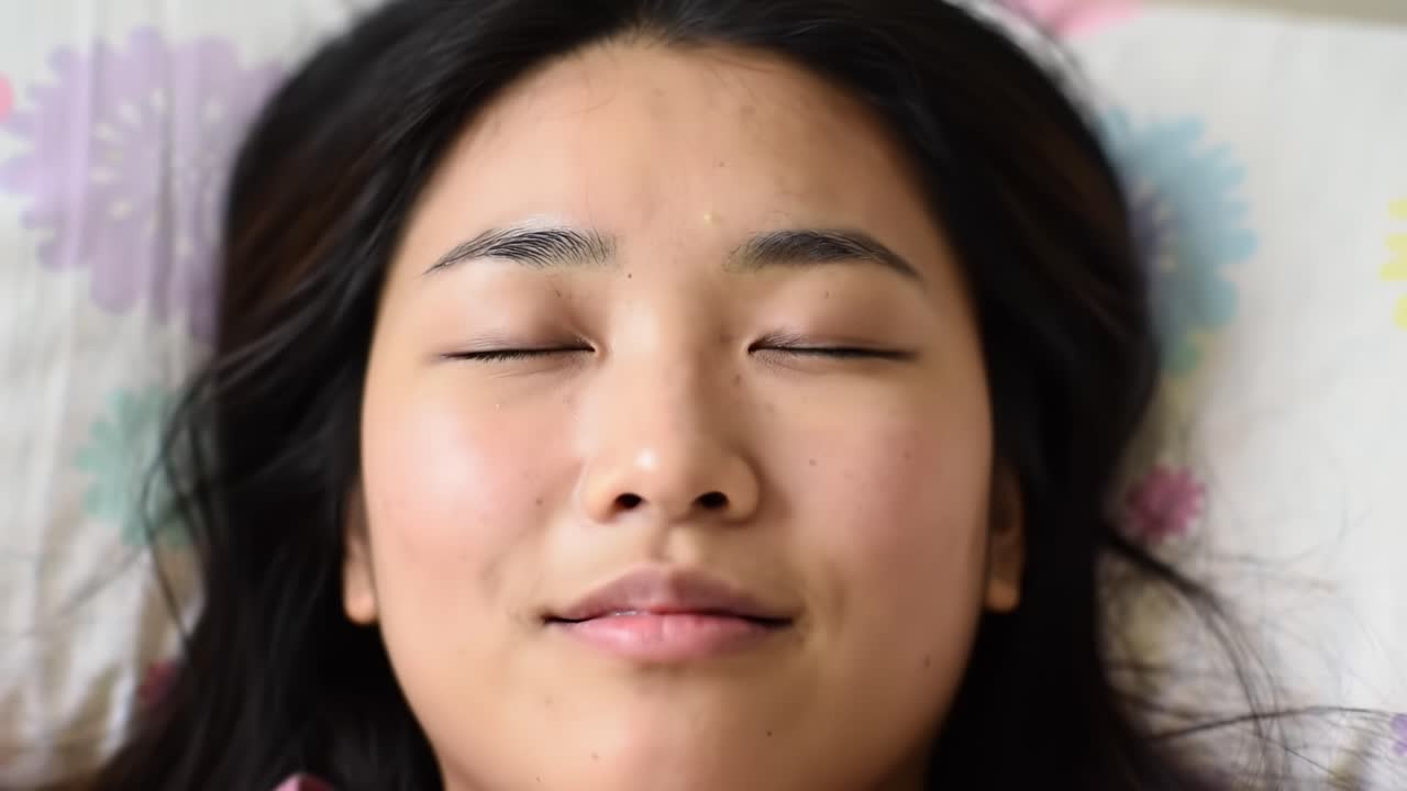 Calm and Serene Moments: Capturing the Peaceful Expression of a Young Woman Resting, Embodying Tranquility and Relaxation in a Cozy Setting