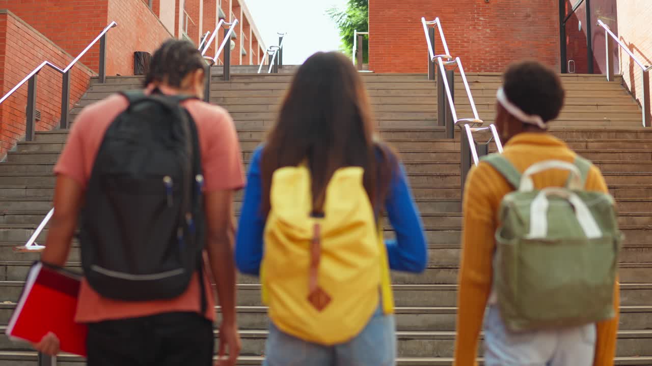 Students walking up stairs on campus