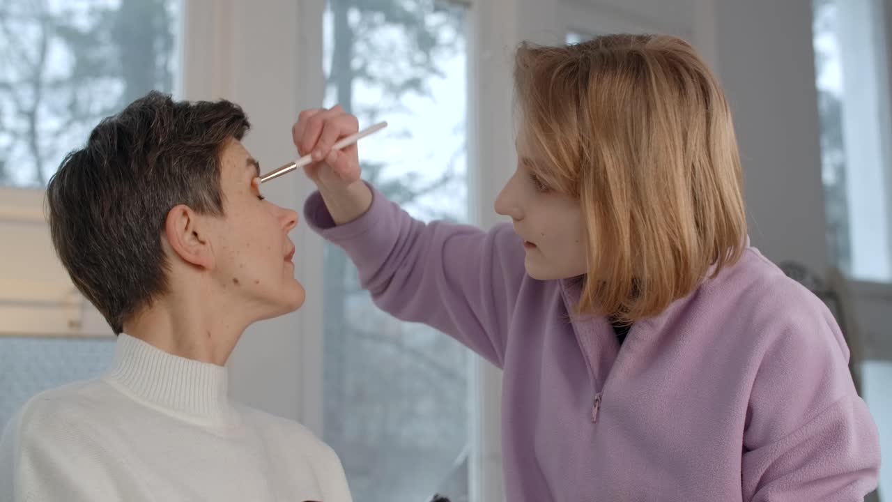 Mother and Daughter Applying Makeup