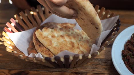 person eating turkish bread