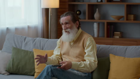 Elderly man watching TV