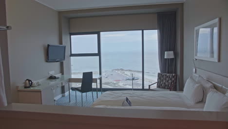 cosy hotel room with white bed seaside view south africa