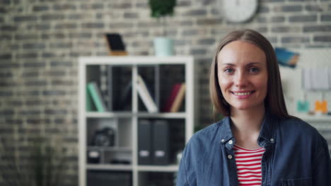 woman smiling in a modern office