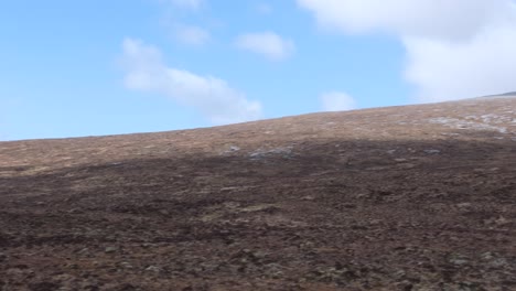 Slow-pan-of-vast,-rugged-and-scenic-mountain-of-Quinag-Sail-Gharbh-in-Sutherland,-highlands-of-Scotland-UK