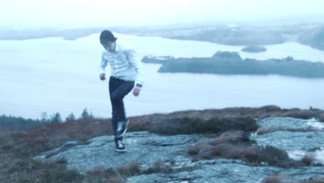 a young man dancing in the rain mountain view