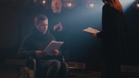 diverse actors team reading their scripts during theatre drama play rehearsal diverse actors team reading their scripts during theatre drama play rehearsal in library showing dedication to script practice role preparation together for dramatic arts reenactment camera a