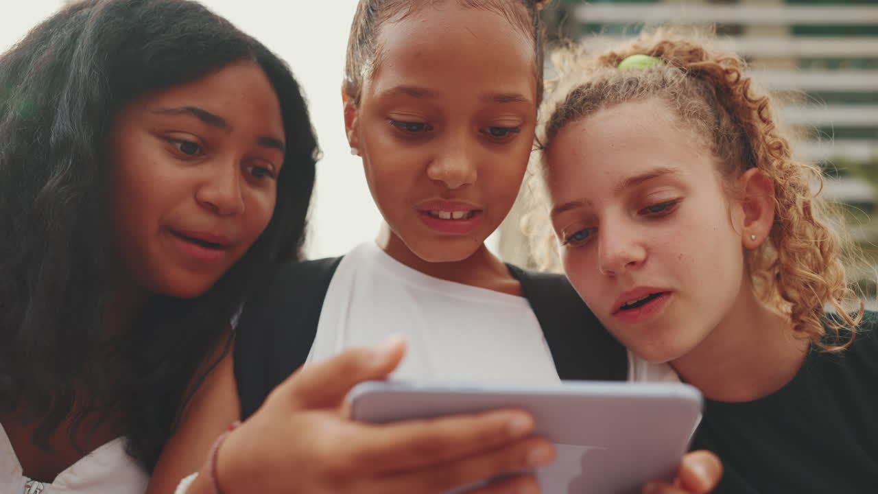 Teenage Girls Using a Smartphone Together