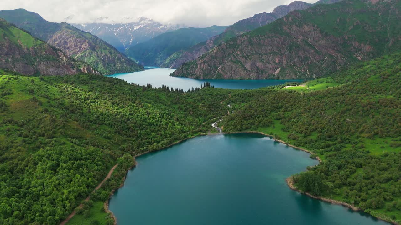 scenic travel destination in sary chelek lake Kyrgyzstan central asia natural reservoir aerial drone footage
