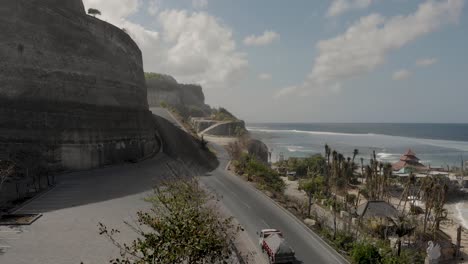 coastal road and parking by melasti beach ungasan, bali, indonesia, aerial view