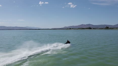 Adrenaline-Thrill-Seeker-Speeding-on-Jet-Ski-Sea-Doo-on-Utah-Lake---Aerial