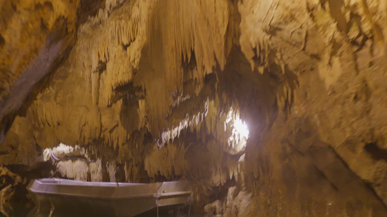 Calm boat ride through a stunning underground river in France