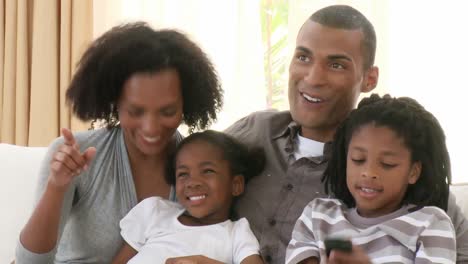 close up of afroamerican family watching television