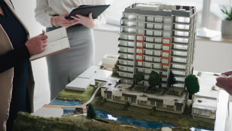 architectural model of a building with people