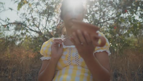 moment-of-creativity-and-focus-as-the-young-woman-works-with-her-hands-surrounded-by-nature