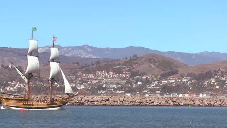 a tall master schooner sails into ventura harbor