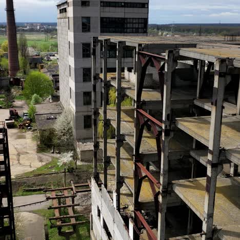 destroyed buildings. abandoned territory of an old industrial plant. ancient factory with ruined buildings. aerial flight