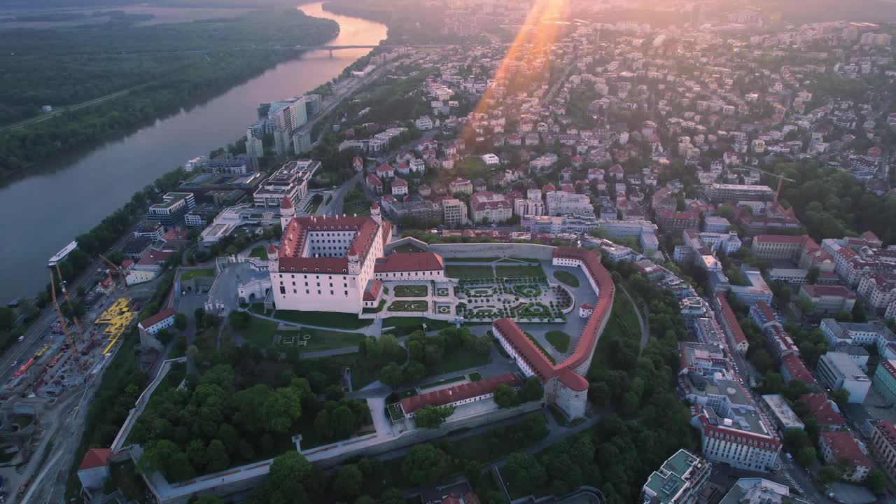 Stunning bird's eye view aerial of Bratislava castle at golden hour