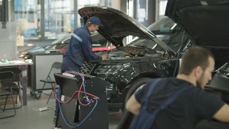 cars undergoing maintenance in auto repair shop