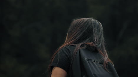 close arc shot of young woman in the alps switzerland