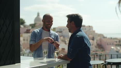 Happy-gay-taking-out-ring-and-proposing-to-lover-during-date