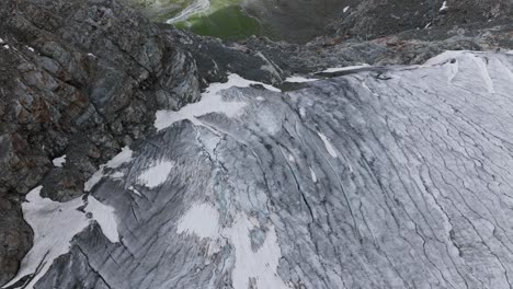 fissures on surface of fellaria of valmalenco italian glacier in summer season