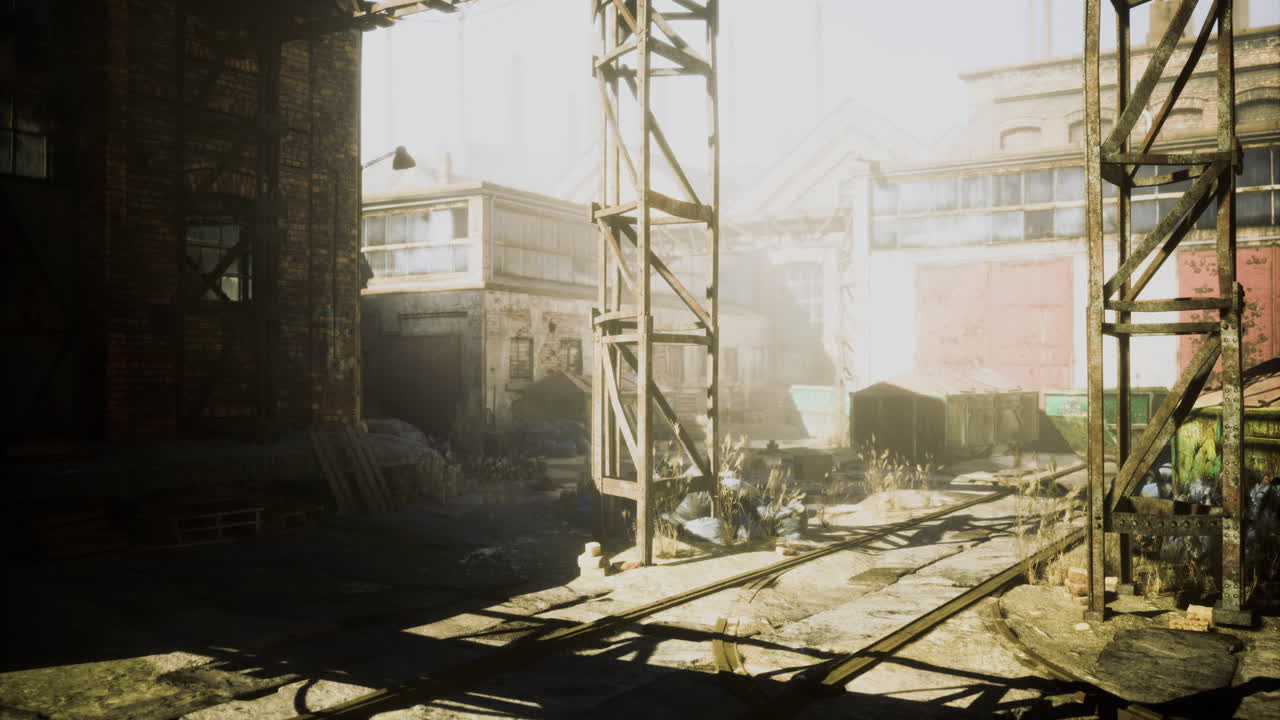 Forgotten industrial site bathed in golden sunlight during early morning hours