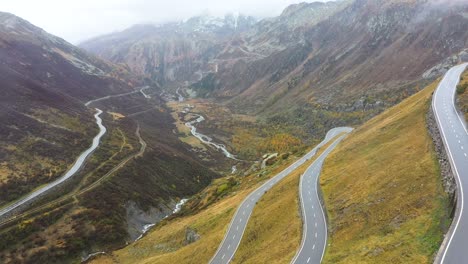 Aerial-View-on-Grimselpass-high-mountian-alpine-road-and-Swiss-Alps-in-background