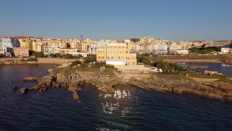 colourful seafront houses in the historic town of alghero, italy