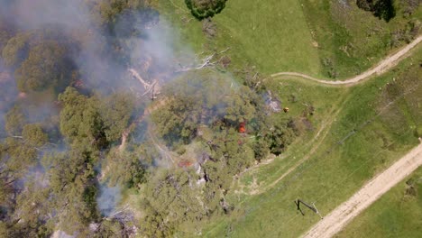 drone shot of fie caught in crackenback forest leading to spreading of smoke in new south wales, australia