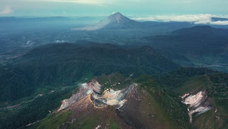 aerial view of stratovolcanoes mount sibayak and mount sinabung at dawn in north sumatra, indonesia