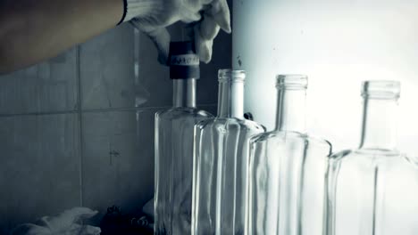 volume of bottles' necks is being measured by a special tool