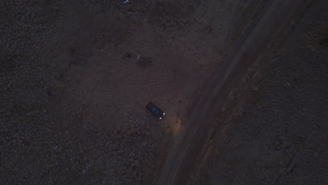 Birds-Eye-View-of-a-single-car-in-Lac-Du-bois-Crasslands-in-Kamloops