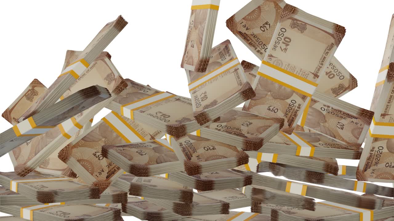 Many wads of money falling on table. 10 Indian Rupees banknotes.