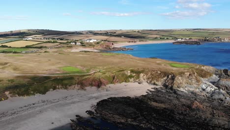 Aerial-pan-of-Thurlestone,-an-English-village