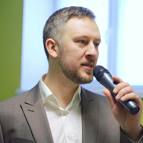 businessman speaking at a podium in a conference or seminar